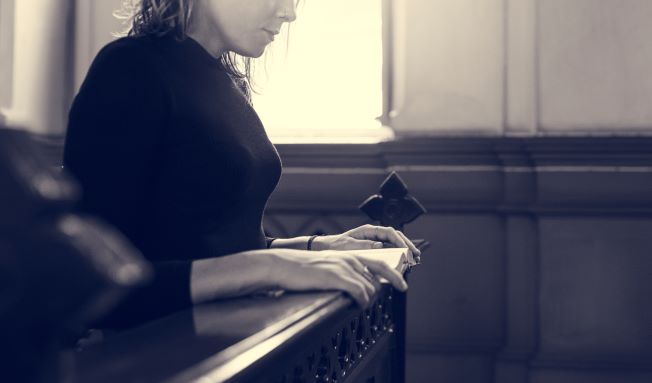 1 woman sitting church religion concept
